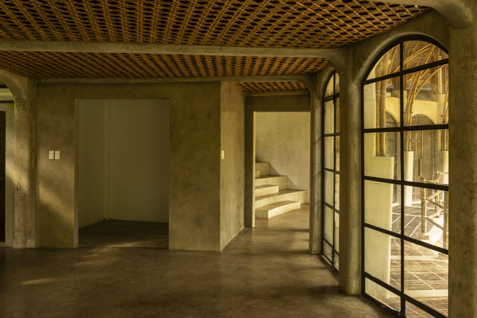 House Formo is a three-bedroom villa organised around a circular plan, built using approximately 1,600 bamboo (bayog) and a 5,000-piece pawid roof. Designed for typhoon resilience and natural ventilation, the house operates without air-conditioning