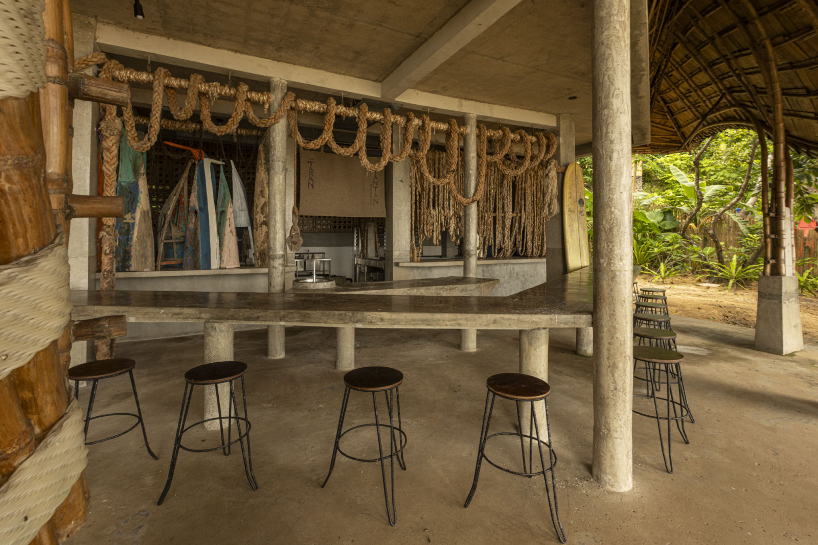 Taran Beach Club is a surf, wellness, and hostel destination built on a remote coastal site accessible only by sea for the transportation of materials during parts of the year
