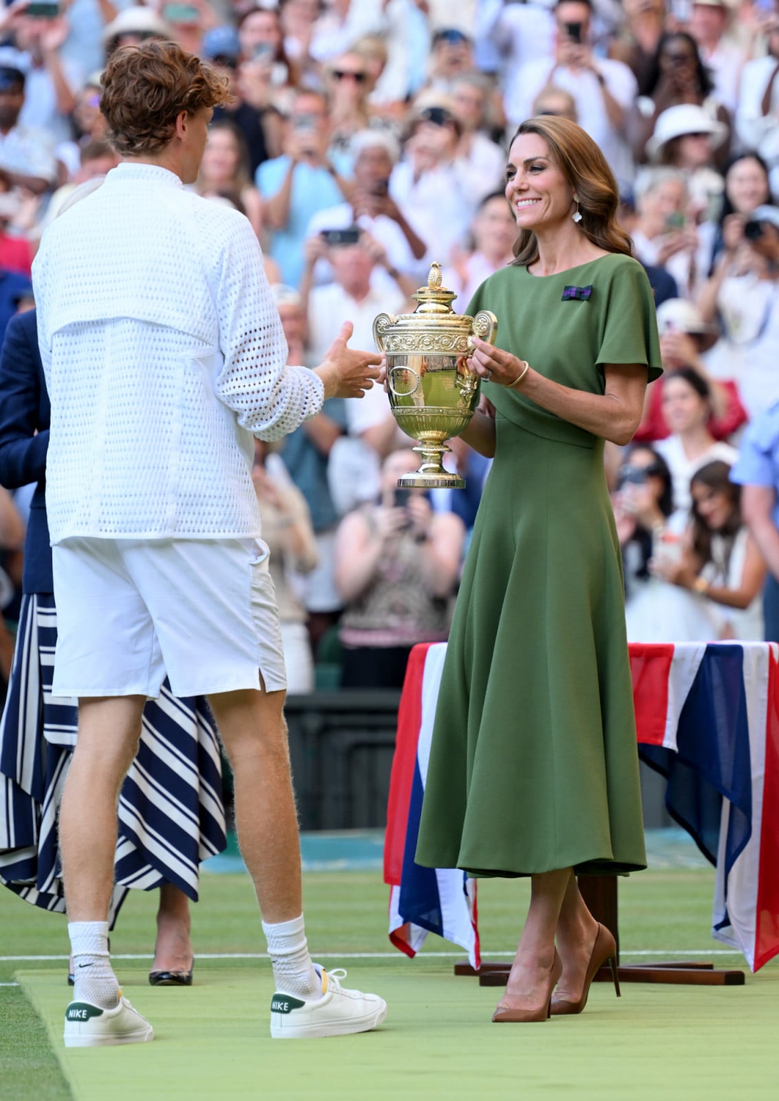 LONDON, ENGLAND - JULY 12: Catherine, Princess of Wales presents the trophy to Jannik Sinner as she attends day fourteen of the 2026 Wimbledon Tennis Championships at the All England Lawn Tennis and Croquet Club on July 12, 2026 in London, England.  (Photo by Karwai Tang/WireImage)