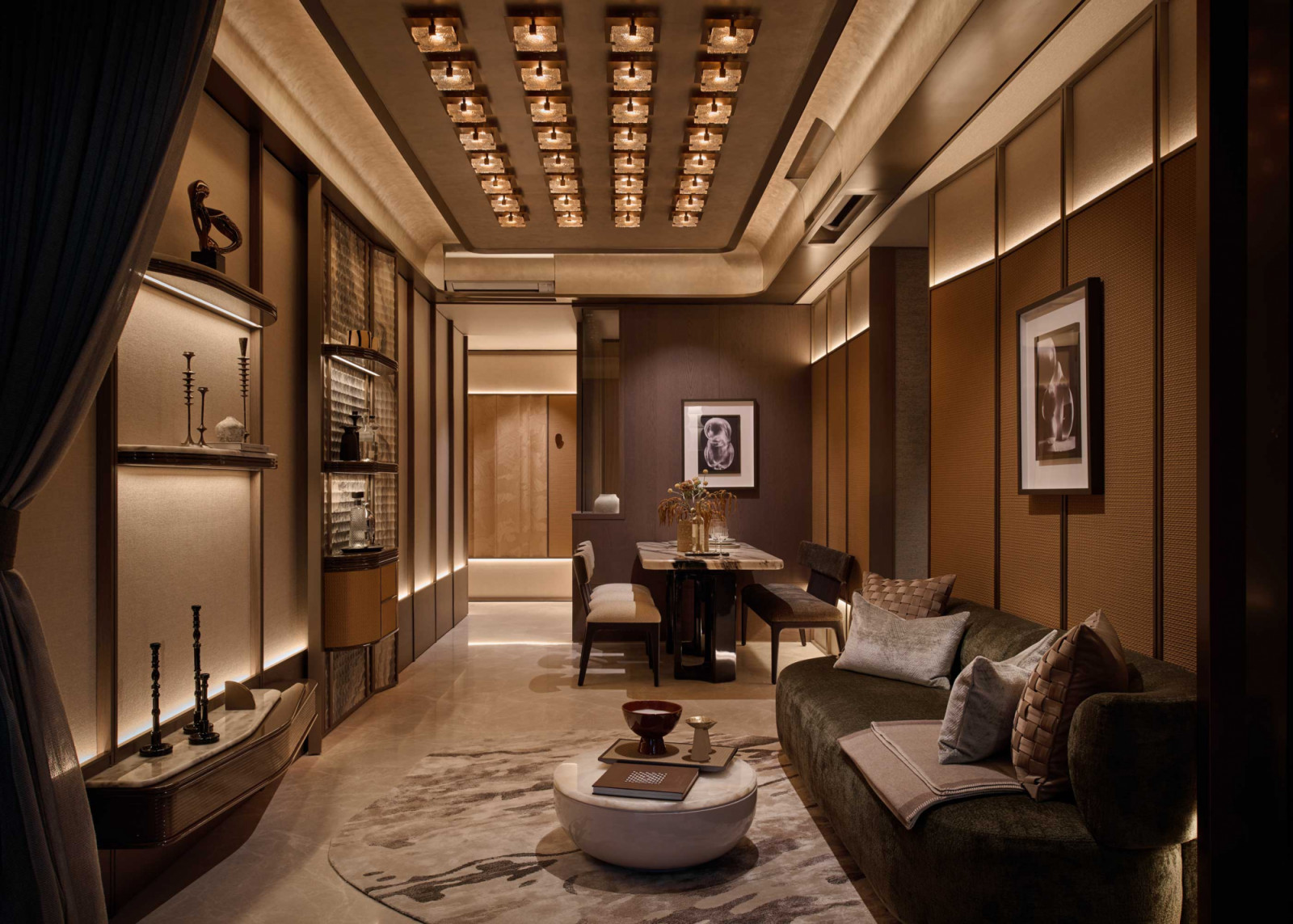 The linear living and dining space is articulated through layered wall panels and a grid of ceiling lights that adds rhythm overhead