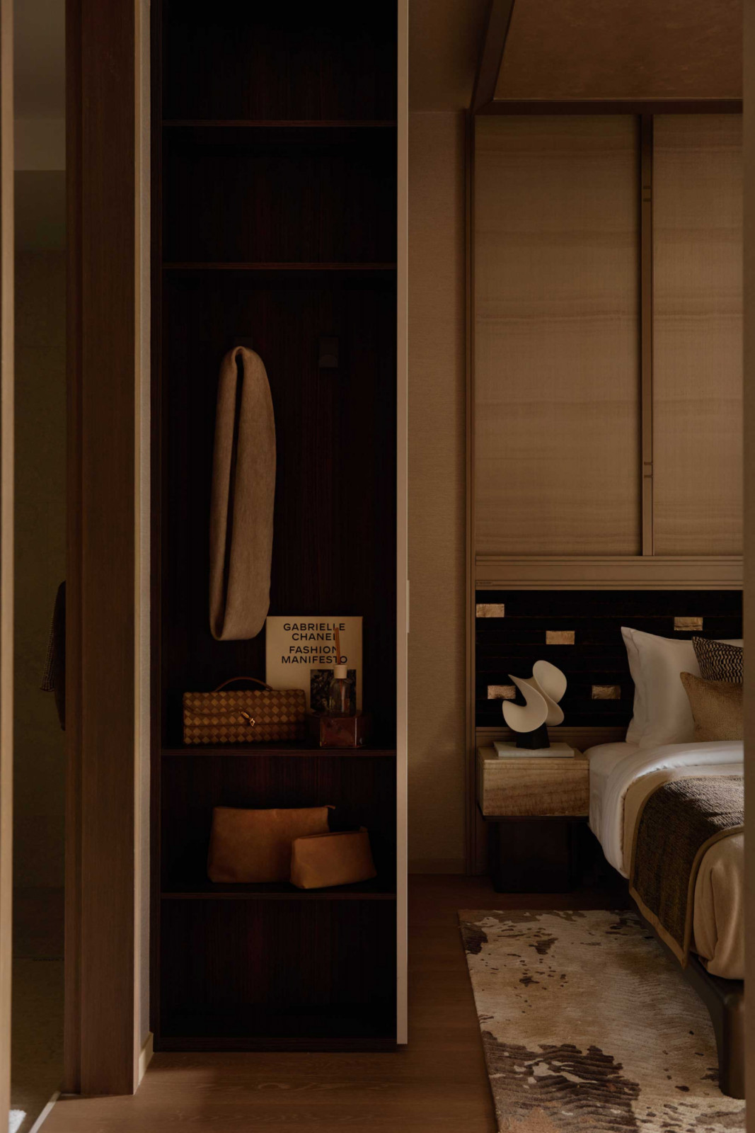 A built-in wardrobe transitions into the bedroom