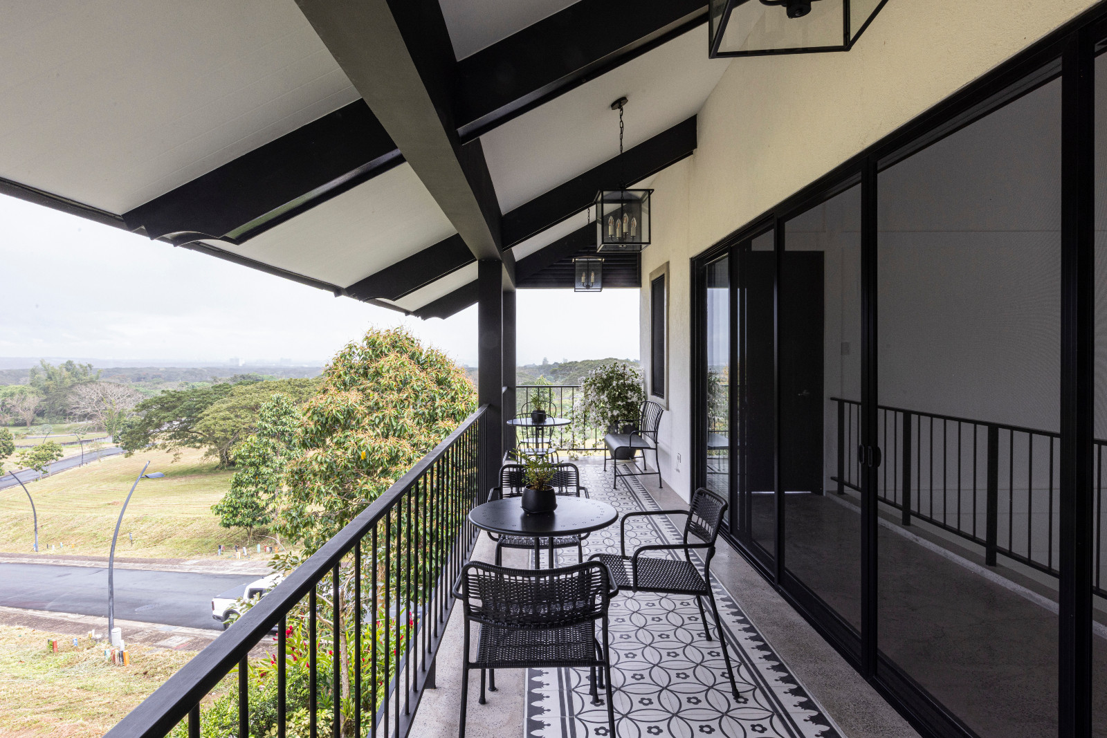 The balcony of a black-and-white heritage home designed by architect Miko De Los Reyes of Imagimax in Manila, Philippines