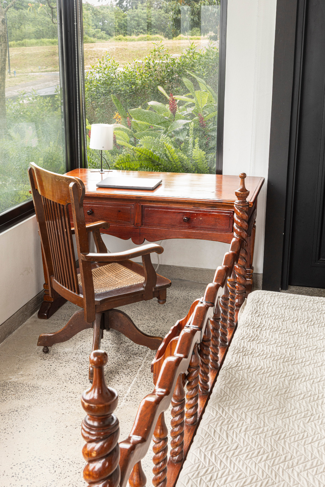 The details of a black-and-white heritage home designed by architect Miko De Los Reyes of Imagimax in Manila, Philippines