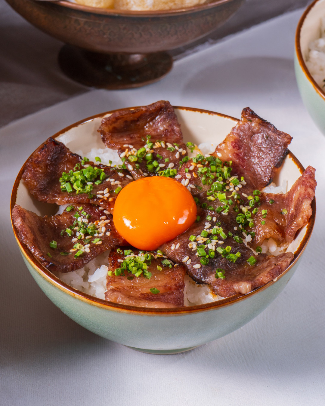 Truffle Nikudon, a slow-braised beef over rice with an omega egg