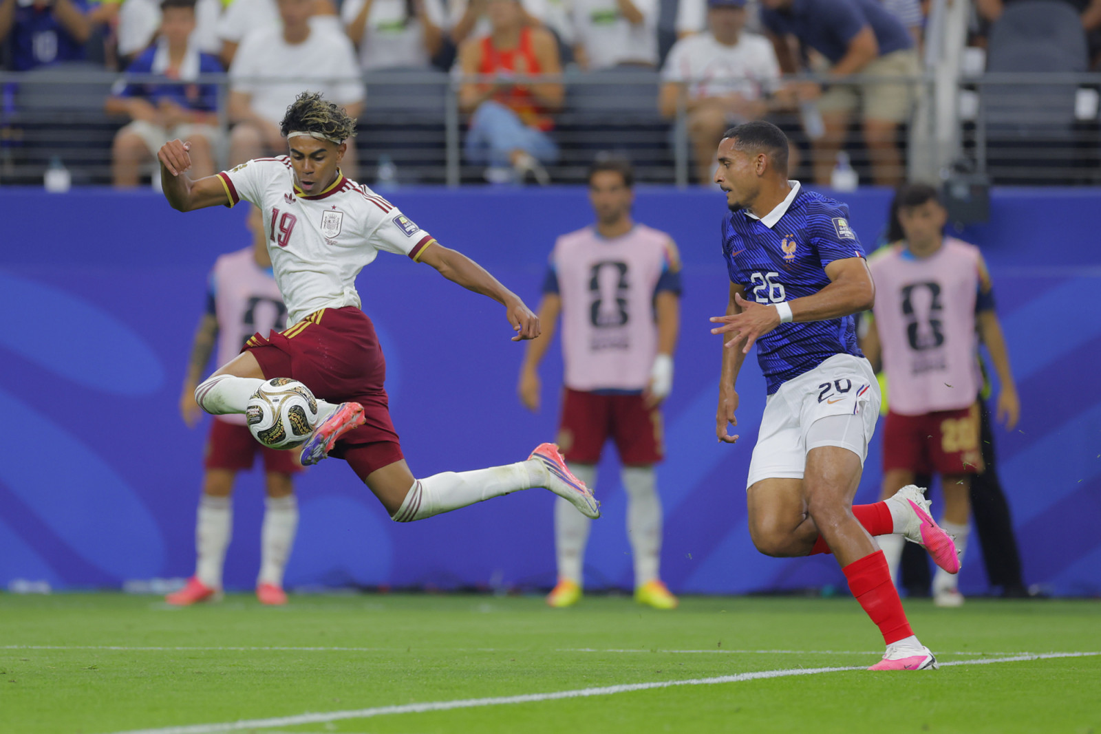 ARLINGTON, TEXAS - JULY 14: Lamine Yamal (L) of Spain and Maxence Lacroix (R) of France controls the ball during the FIFA World Cup 2026 Semi Final match between France and Spain at Dallas Stadium on July 14, 2026 in Arlington, United States. (Photo by Hugo Rivera/Jam Media/Getty Images)