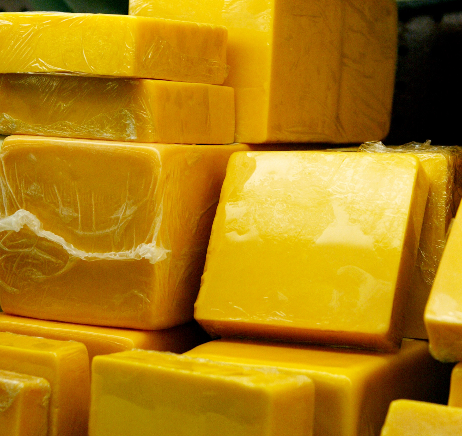 Authentic Cheddar is a hard cheese originating from Somerset that offers a rich, crumbly, and distinctively nutty flavor profile, far superior to standard factory varieties. (Photo: Getty Images)