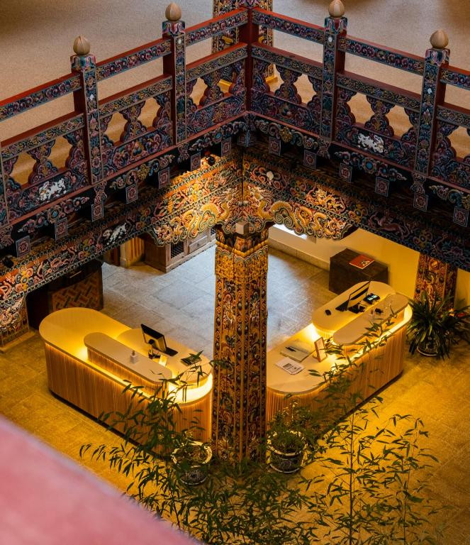 An aerial view of Zhiwaling Heritage’s reception captures the hand-carved timber gallery encircling the atrium below