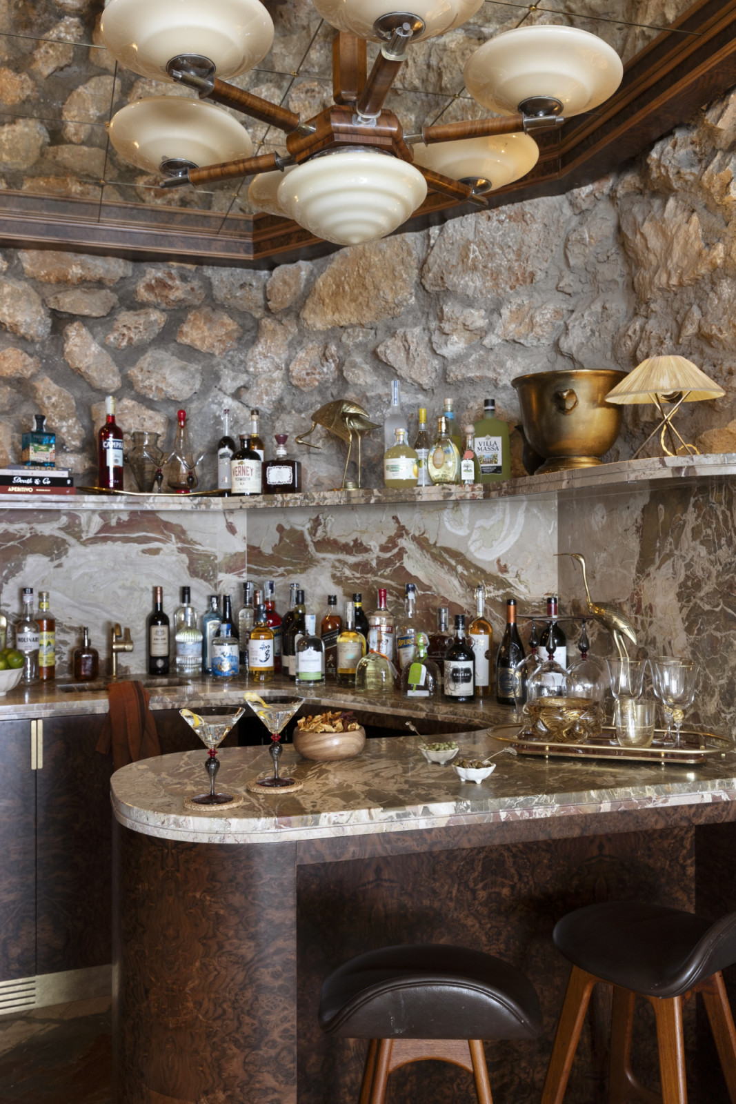Featuring an antique-mirror ceiling, burl wood and Diaspro marble