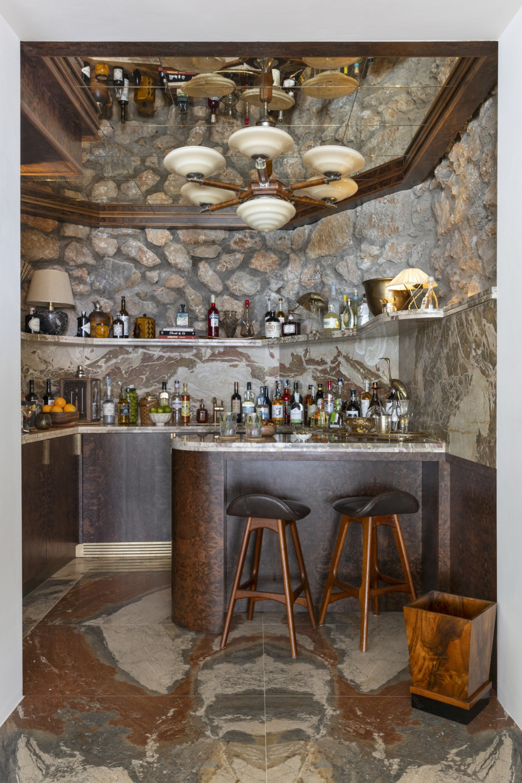 The cave bar next to the dining area featuring the original rock wall