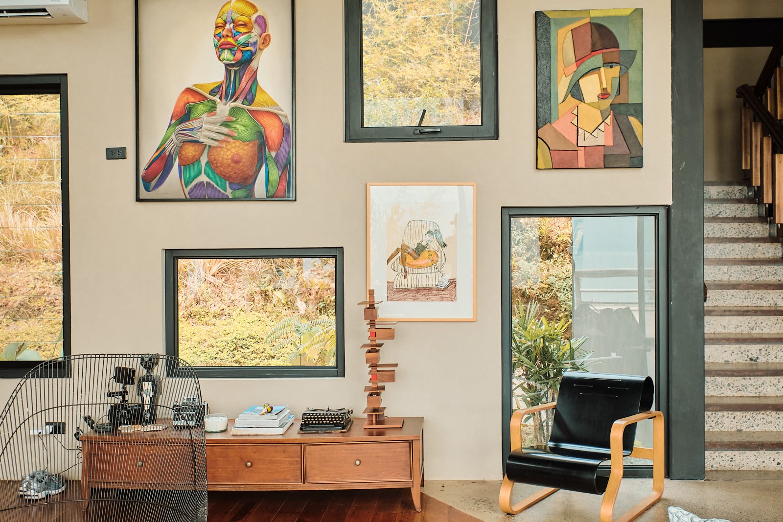 The art gallery wall in Tanua Private Retreat, Batangas, designed by Martin and Melissa Rosario (Photo: Sproos Creatives)