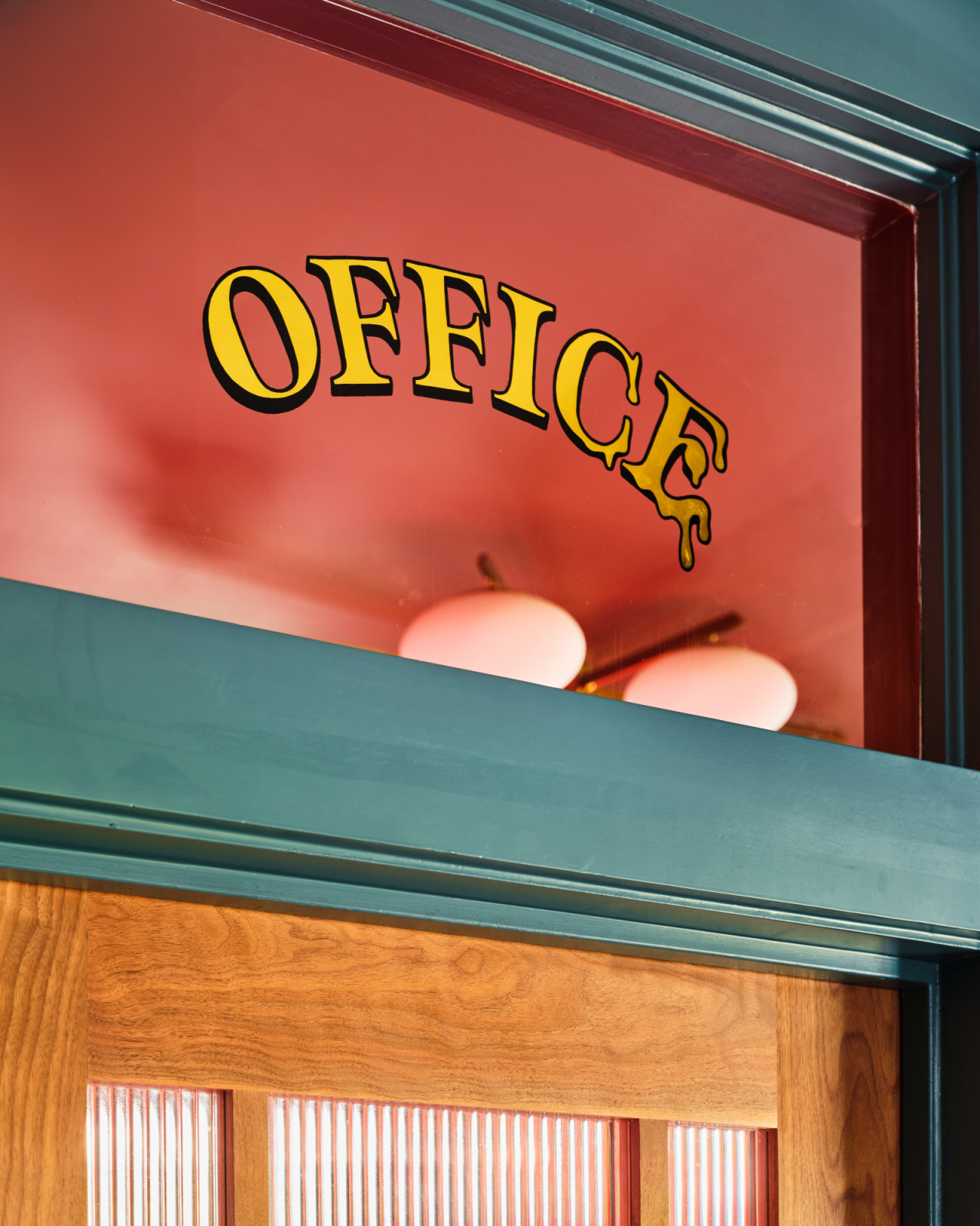 The hand painted office signage on the glass transom by Joe Swec (Photo: Clay Grier)