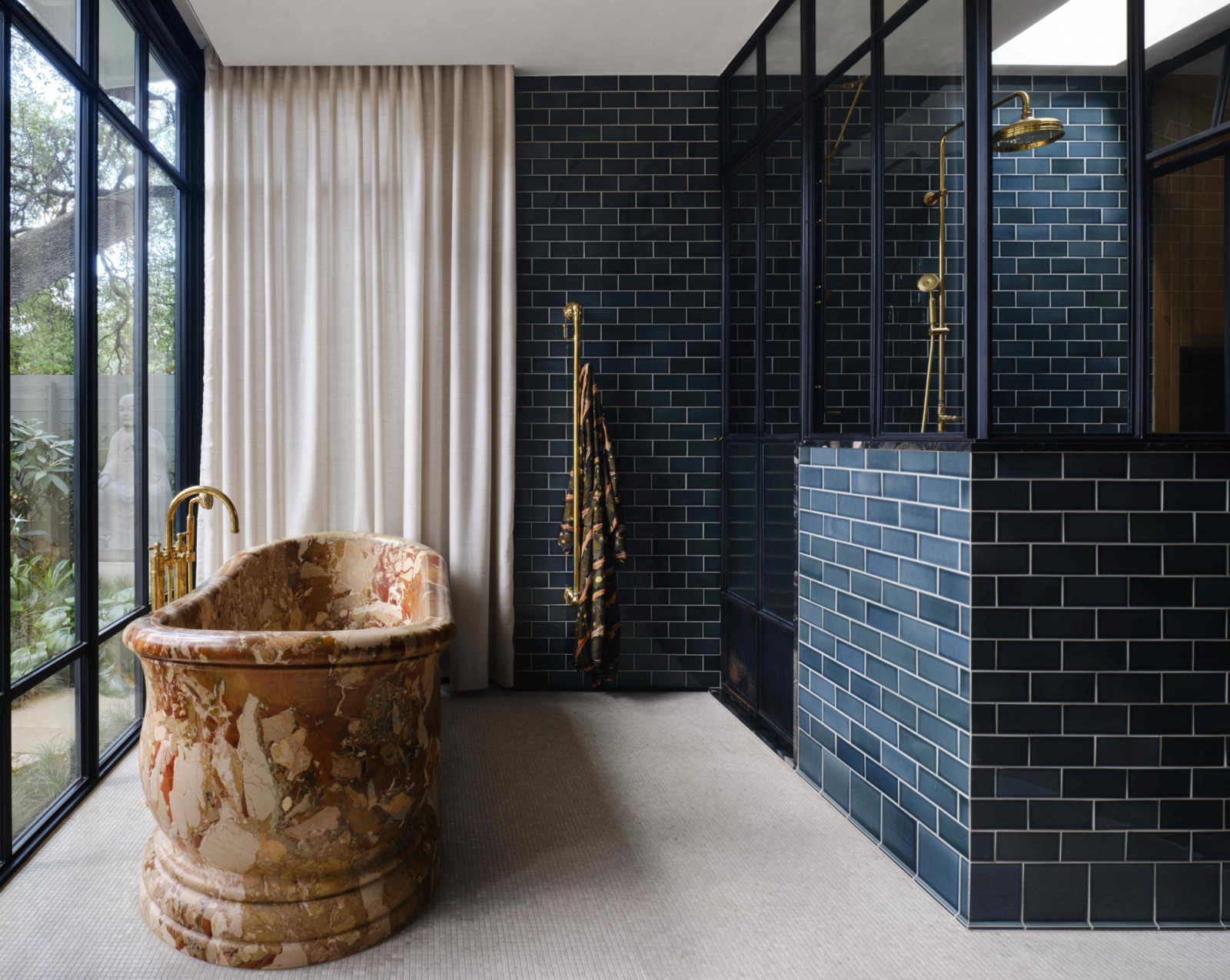 The primary bathroom, anchored by a 3,000-pound marble bathtub