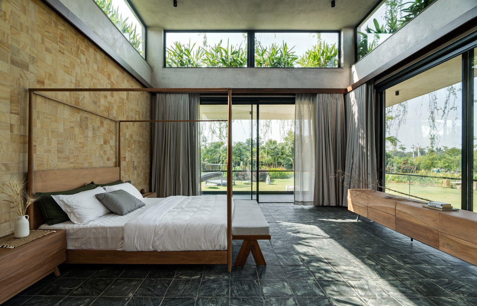 The primary bedroom of a multigenerational home designed by 23 Degrees Design Shift in Hyderabad, India
