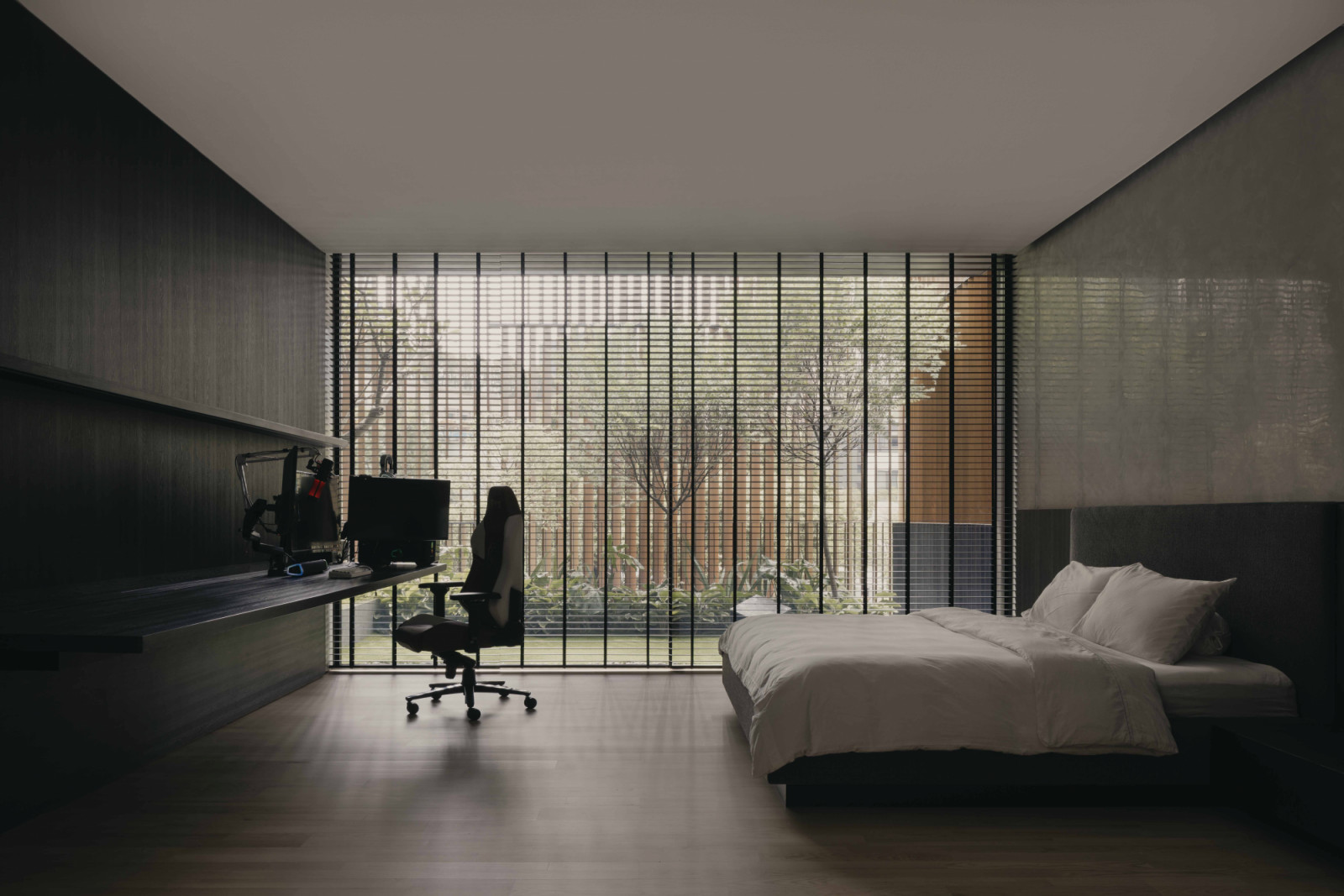 A carefully orchestrated arrangement of screens maintains this bedroom's connection to nature while preserving privacy