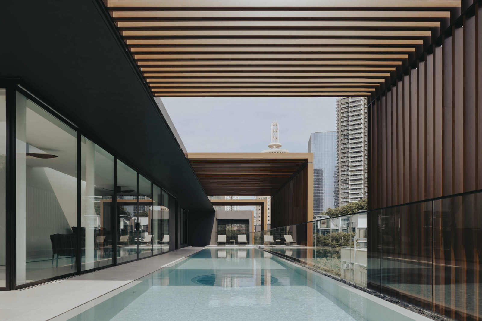 Crowning the house is a dramatic 20-metre swimming pool that stretches across the attic level, transforming the rooftop into an elevated retreat