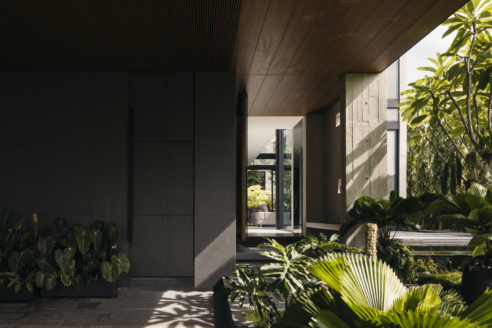 House of Greens is a 7,600-square-foot detached residence conceived as a contemporary tropical sanctuary where architecture and landscape are inseparably intertwined