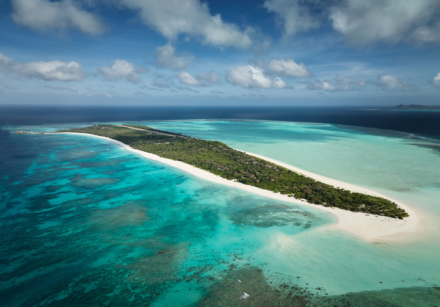 Pamalican Island, the exclusive setting for Amanpulo, features expansive white sand beaches and clear coral waters.