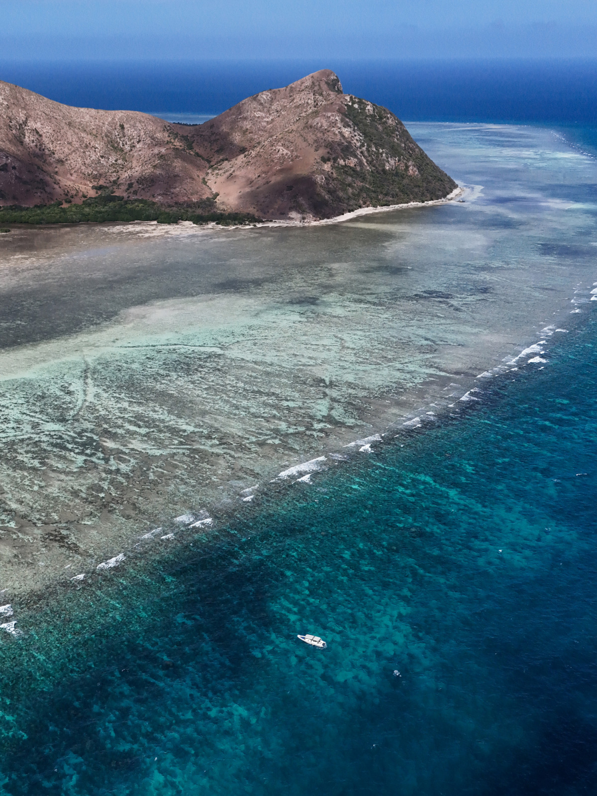 Pamalican Island, home to Amanpulo, showcases its vibrant coral reefs and turquoise waters.