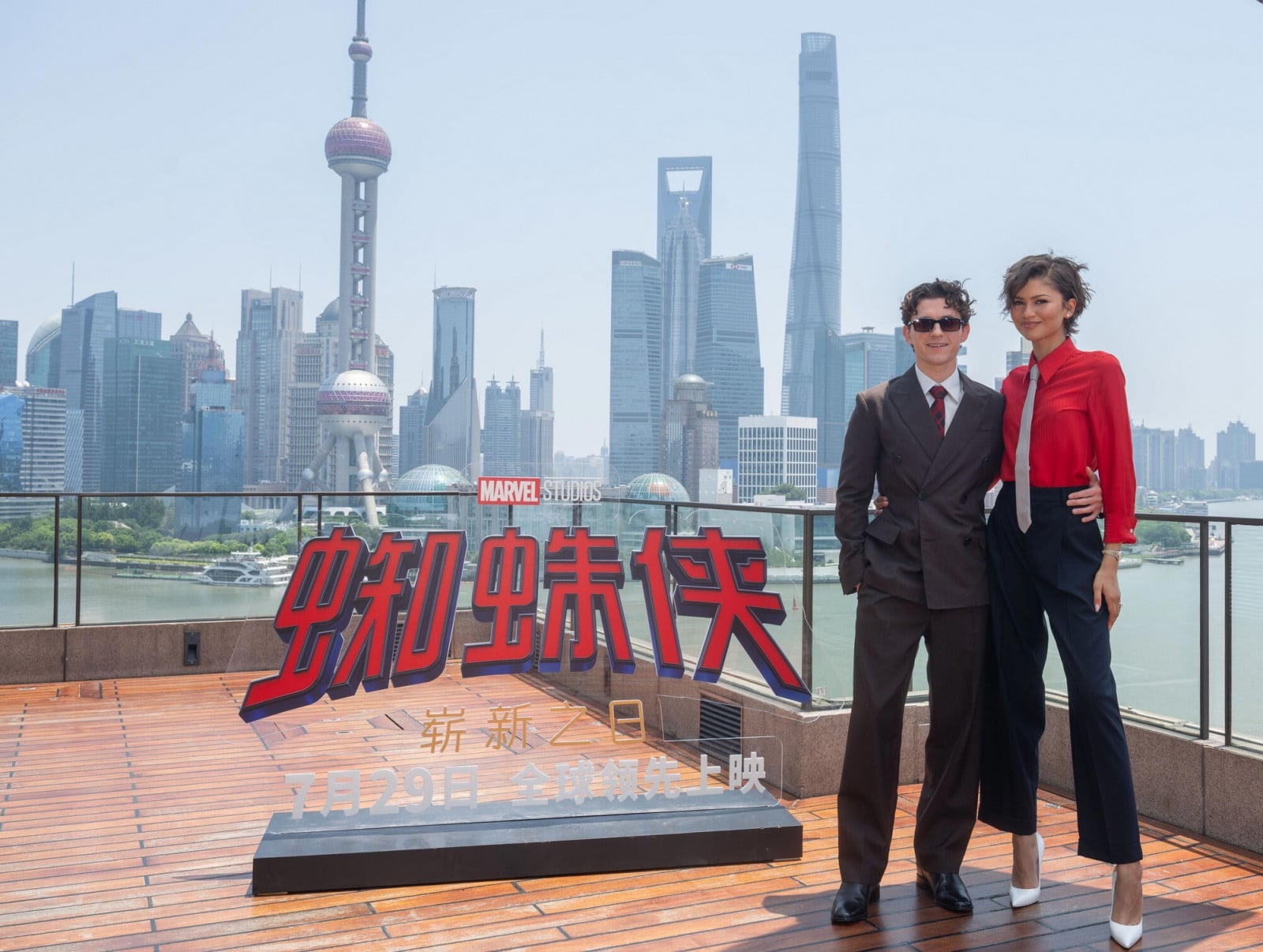 Actors Tom Holland and Zendaya promote Marvel Studios' Spider-Man against Shanghai's iconic skyline.