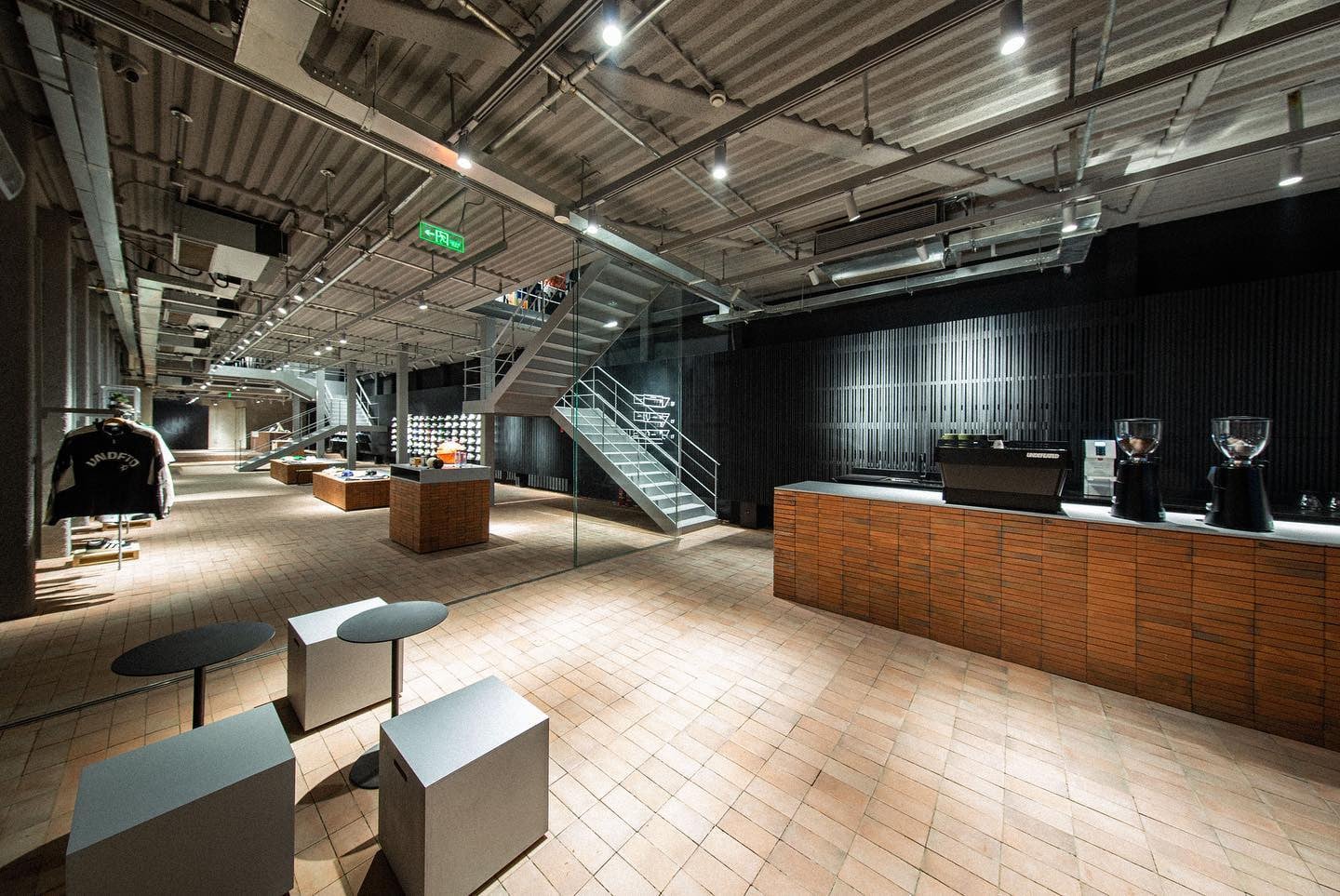 The Undefeated flagship store in Shanghai features a multi-level retail space with an integrated coffee bar.