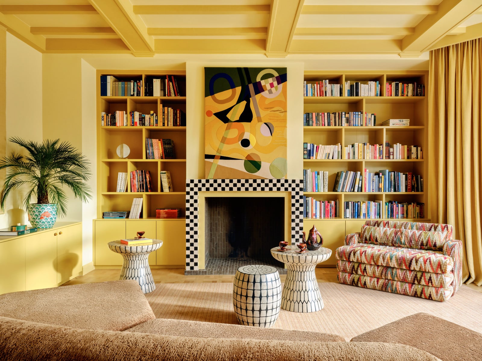 A buttery yellow palette sets a joyful tone in the living room as natural light floods the space
