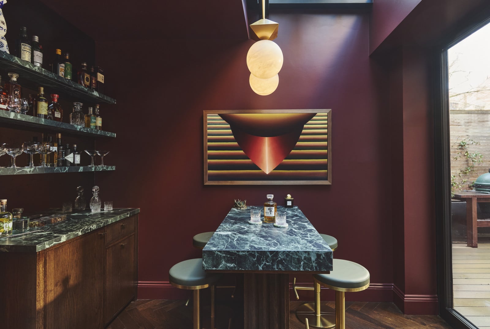 The upstairs bar area of a Notting Hill home by Project London