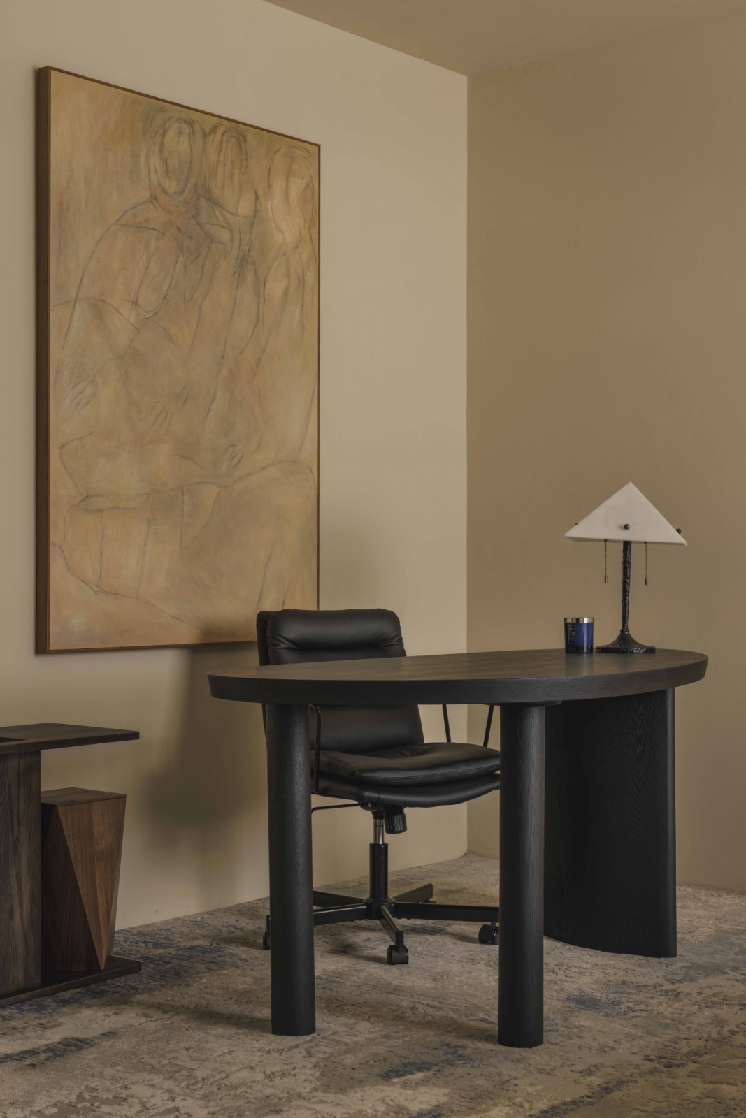 A corner of the study, anchored by a stately table