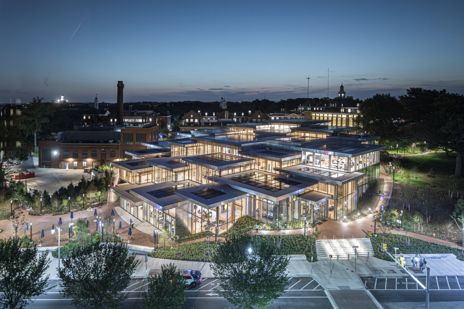 At dusk, the building’s cascading pavilions catch the last light against Homewood campus’s historic brick backdrop (Photo: Laurian Ghinitoiu)