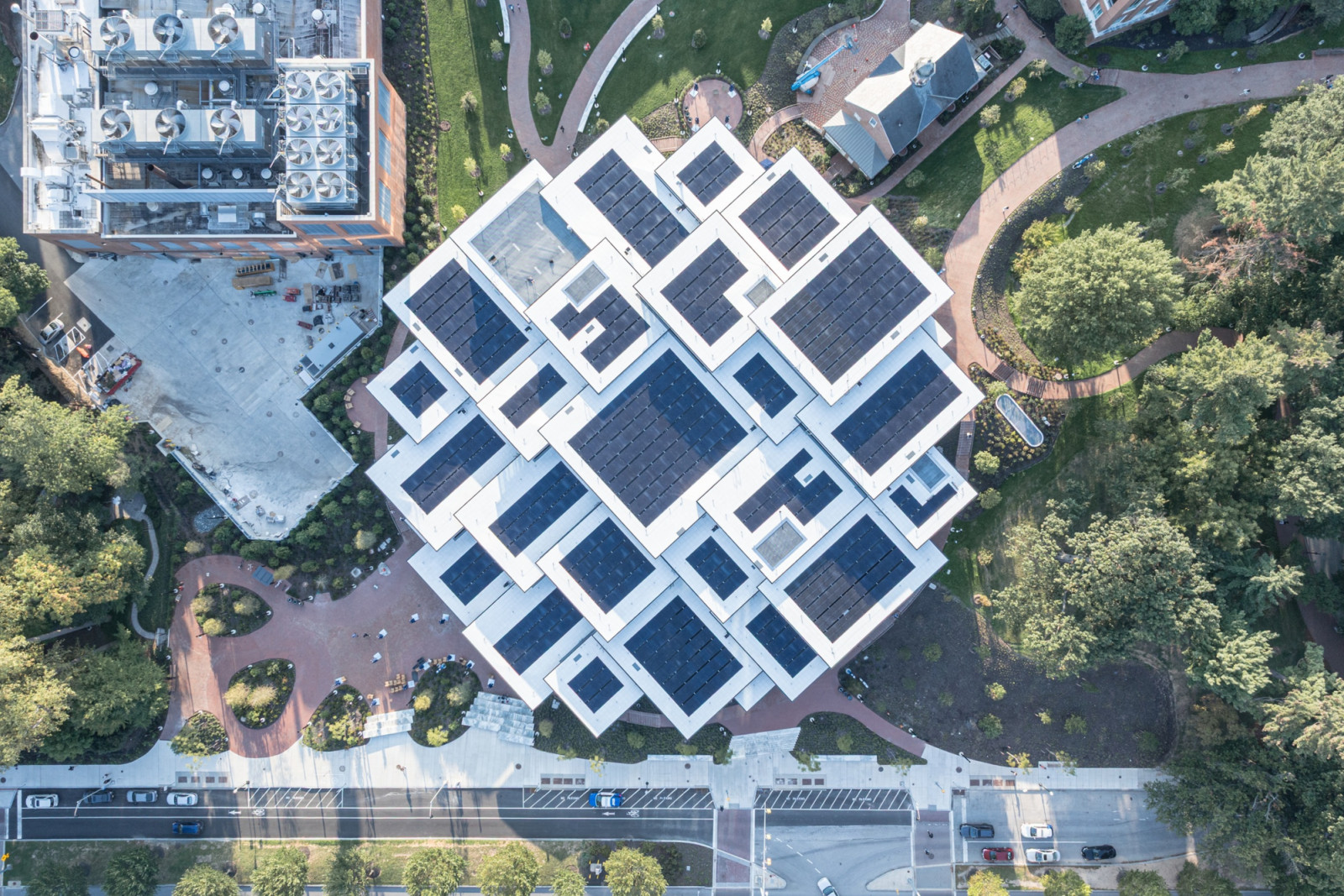 Viewed directly from above, 29 diamond-shaped roofs interlock across the hillside, most fitted with solar panels (Photo: Laurian Ghinitoiu)