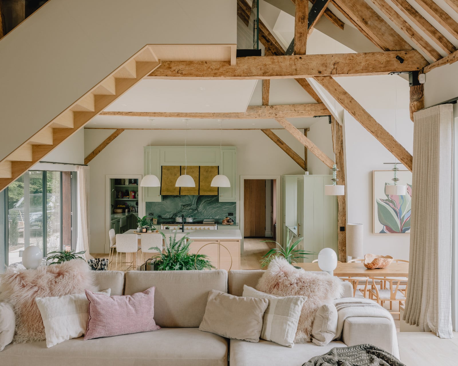 The living room of a renovated barn home in Wiltshire, England by Munro