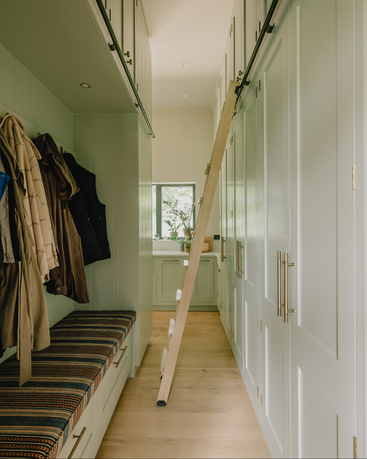 The boot room of a renovated barn home in Wiltshire, England by Munro