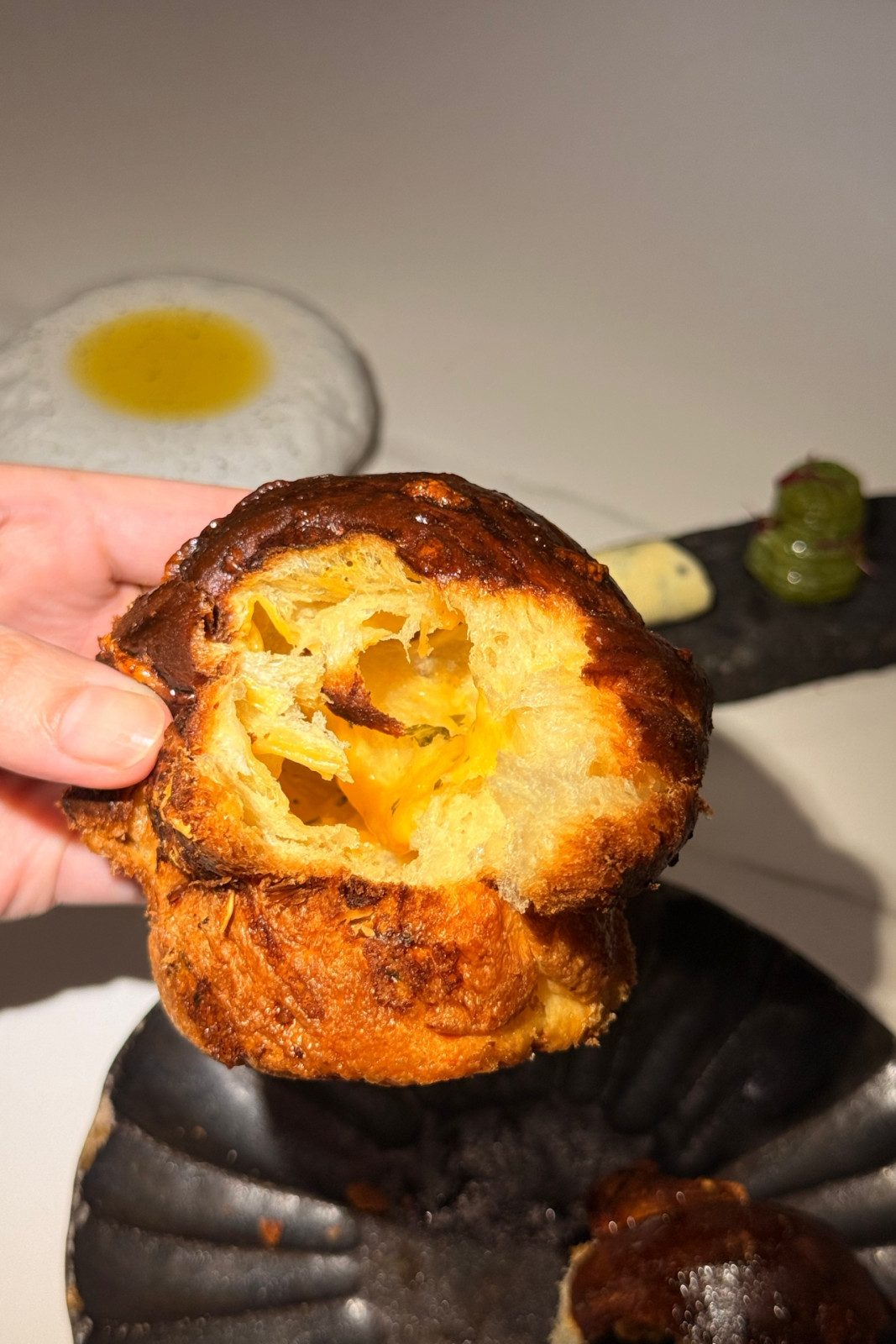 Laminated brioche with aged Gouda, and sharp cheddar from Helm by Josh Boutwood's Single Ingredient menu