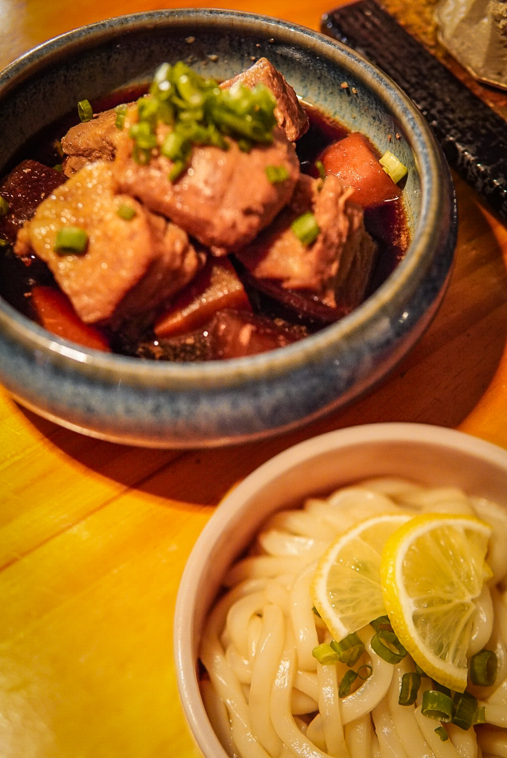 Succulent braised pork belly with root vegetables, paired with refreshing lemon udon noodles.