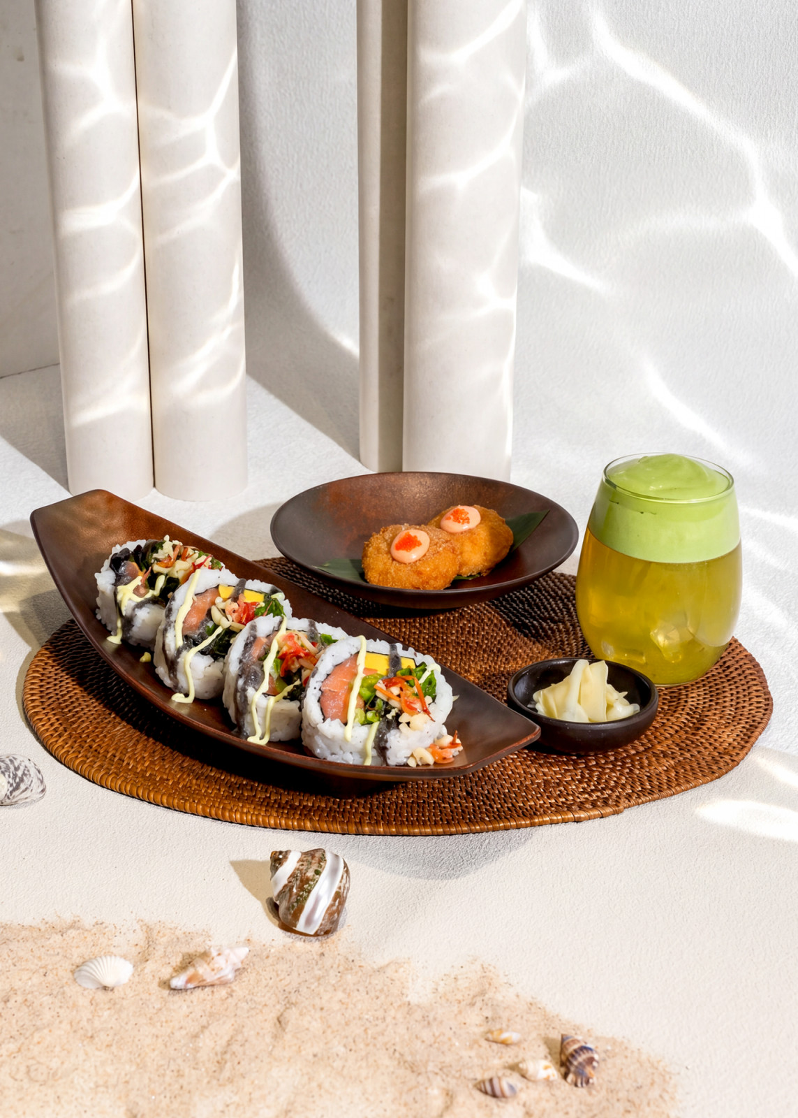 Discover innovative salmon sushi rolls and a refreshing matcha-topped drink, perfect for a modern beachside escape.