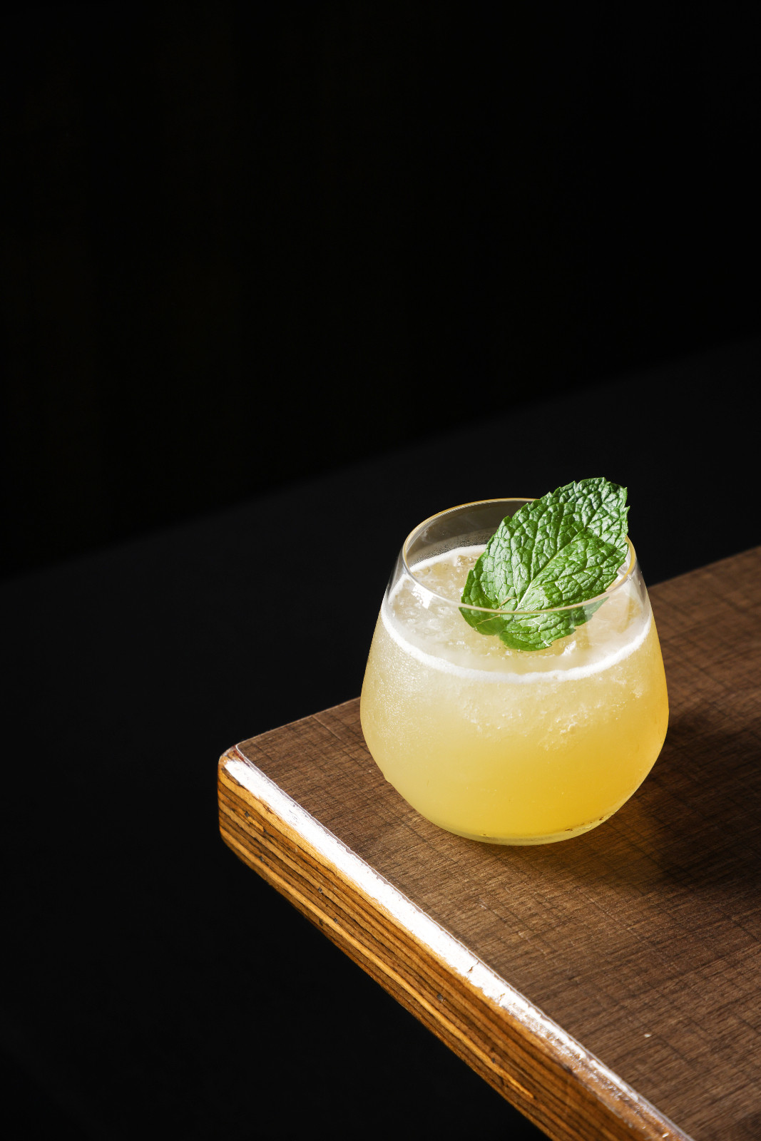 A contemporary cocktail, garnished with fresh mint, signals exciting new beverage trends.