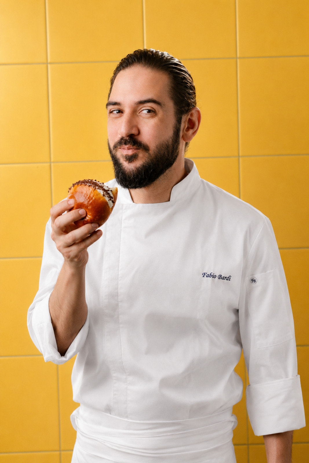 Chef Fabio Bardi presents a new brioche bun, generously filled and topped with chocolate sprinkles.