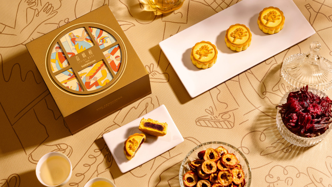 The Peninsula's Spring Moon bakehouse mooncakes, featuring intricate designs and a vibrant purple filling, are enjoyed with tea.