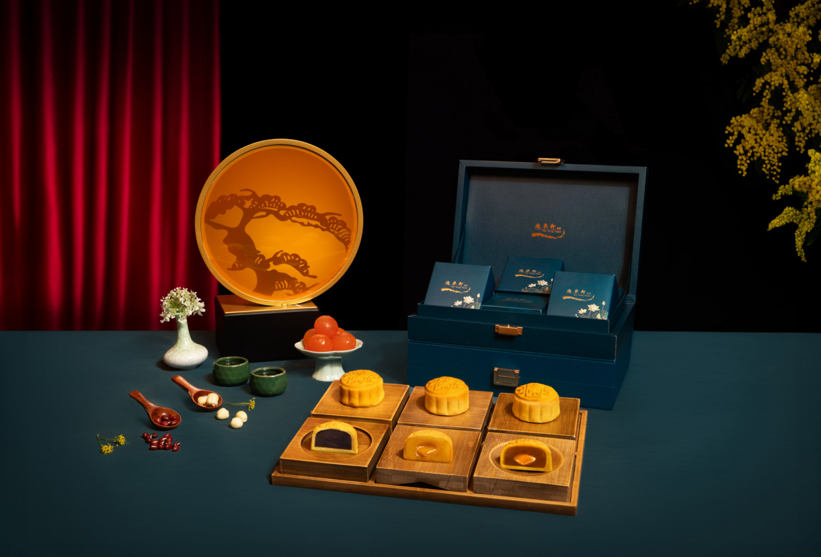 Yat Tung Heen mooncakes are showcased in elegant packaging, featuring fillings like rich red bean paste and golden salted egg yolk.