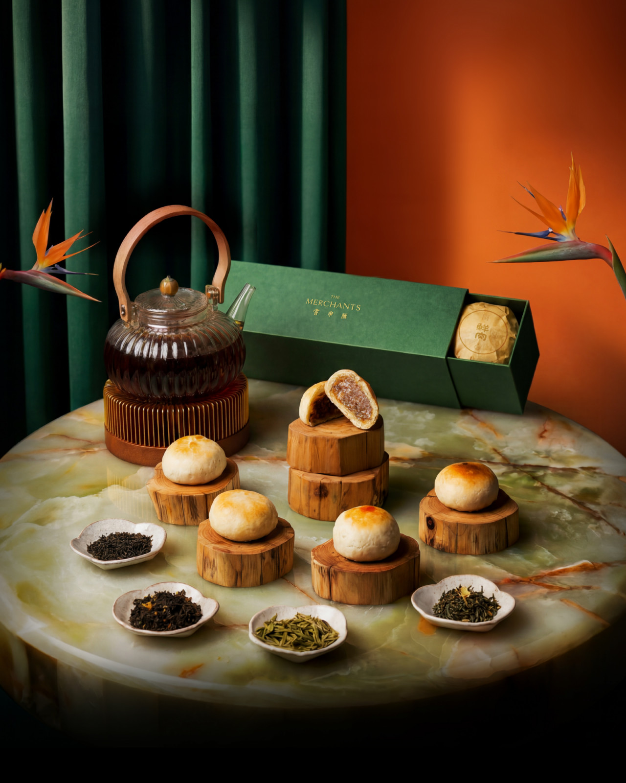 The Merchants' mooncakes, including one showcasing its rich filling, are paired with various loose-leaf teas.