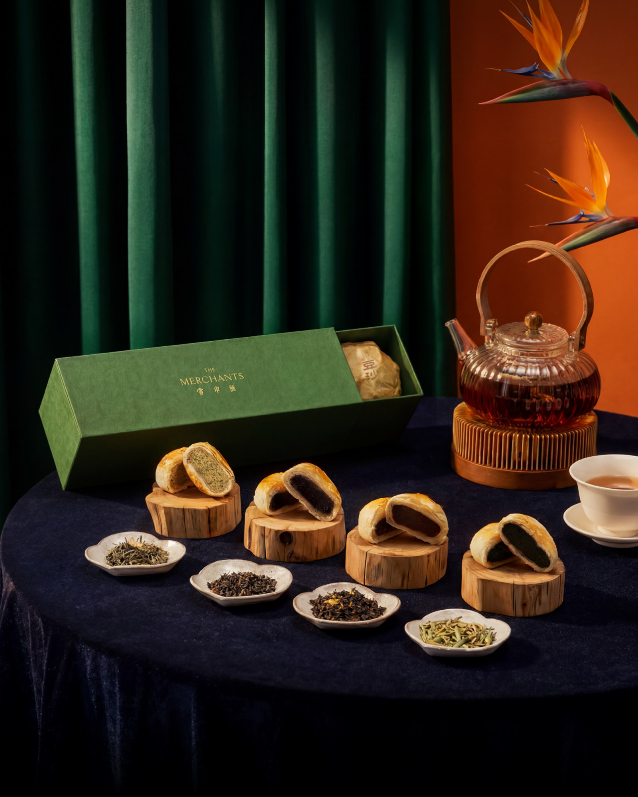 The Merchants' mooncakes with diverse fillings, elegantly paired with a selection of premium teas.