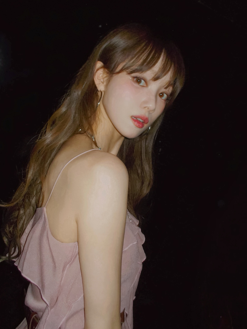 Actress and model Lee Sung-kyung in a ruffled pink dress.