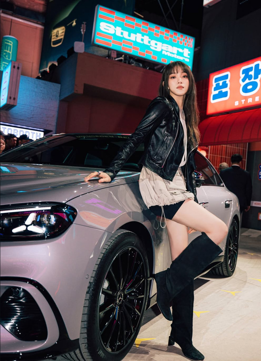 Actress and model Lee Sung-kyung embodies her signature style next to a Mercedes-Benz.