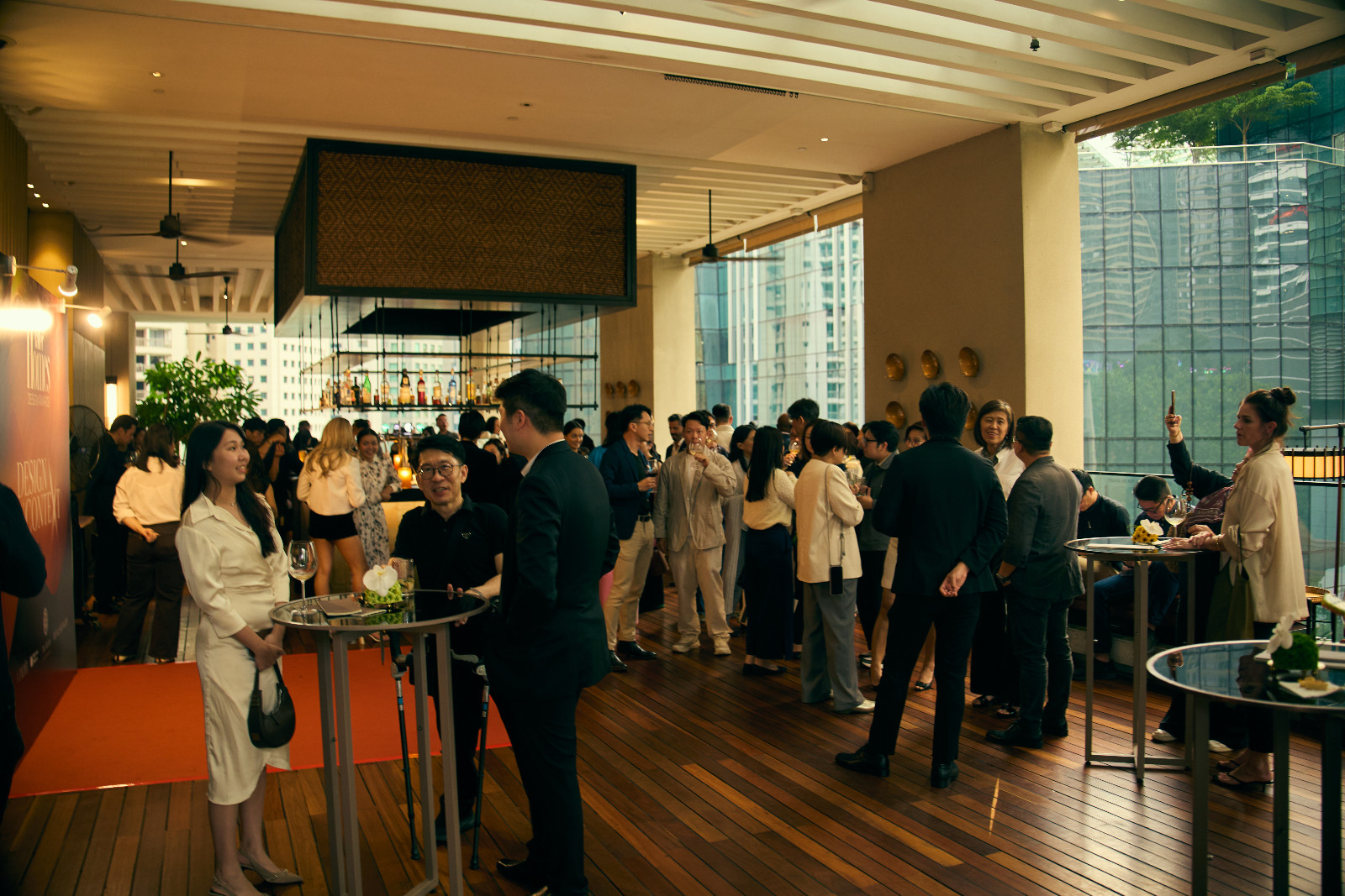 Guests reconnecting ahead of the ceremony at The RuMa’s Santai pool bar and lounge