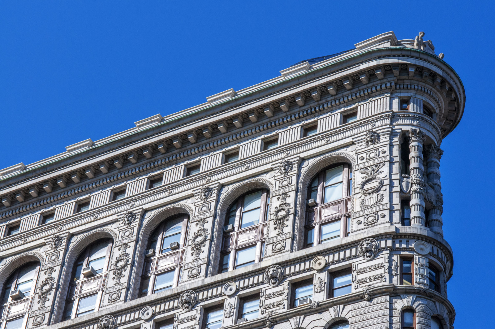 Close view of ornament on the building exterior of Flatiron Building in New York City. The Flatiron Building, originally the Fuller Building, is a steel-framed landmarked building located at 175 Fifth Avenue in the Flatiron District neighborhood of borough of Manhattan, New York City.. (Photo by: Sergi Reboredo/VW Pics/Universal Images Group via Getty Images)