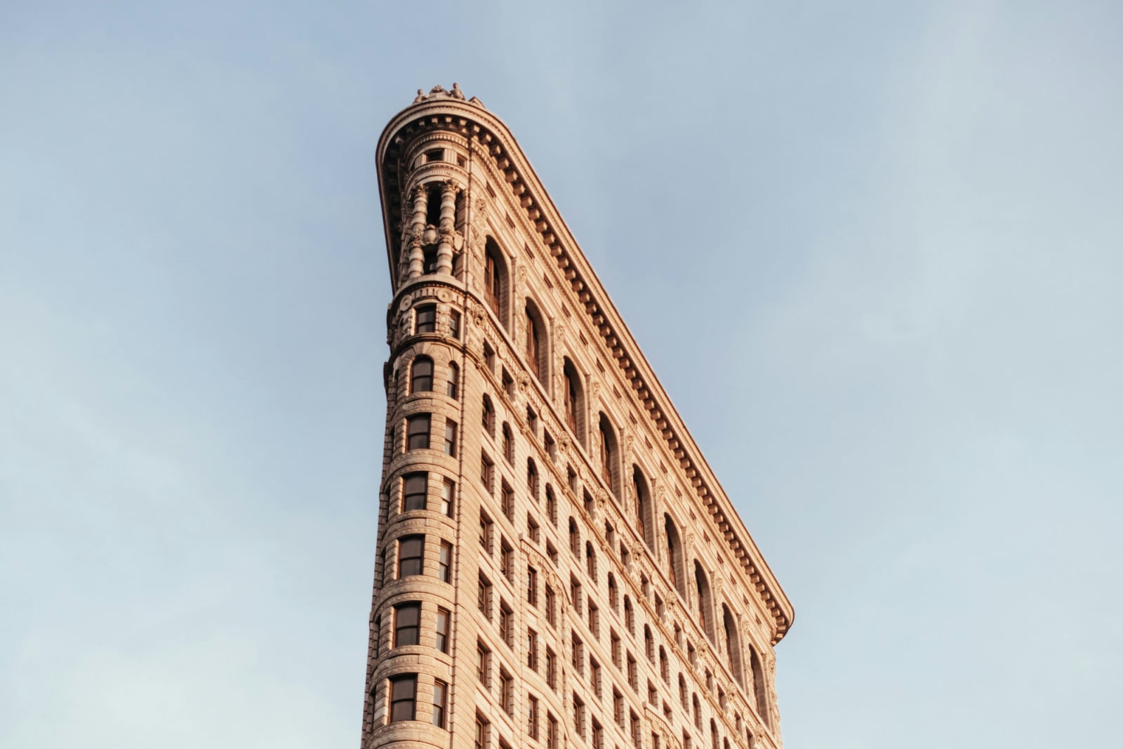 The iconic Flatiron Building in New York City, celebrated for its distinctive triangular architecture.
