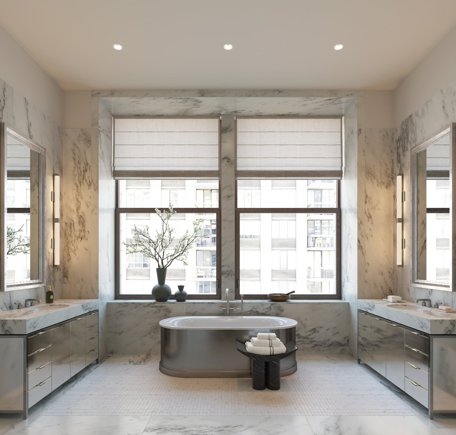 A primary bathroom in a luxury urban residence features a freestanding metal tub, dual marble vanities, and large windows overlooking city buildings.