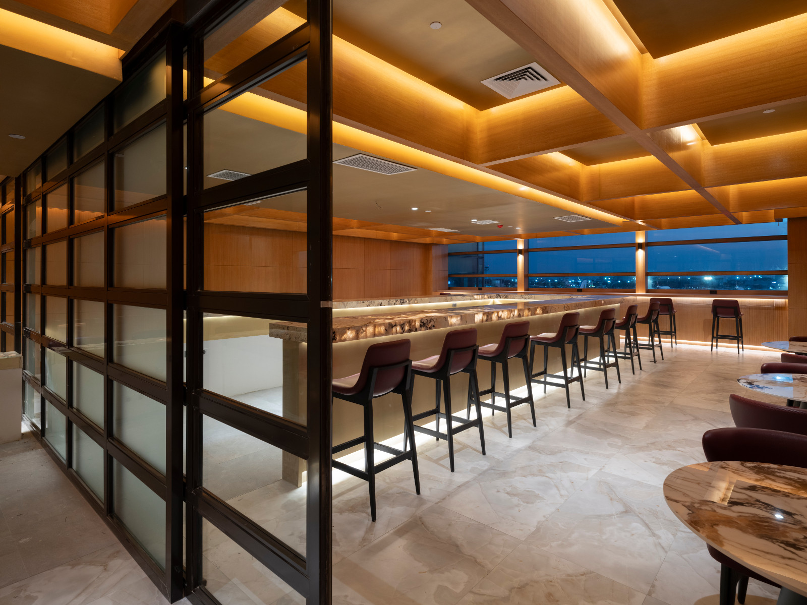 Communal seating in the First Meridian Lounge of NAIA Terminal 3, designed by Carlo Calma
