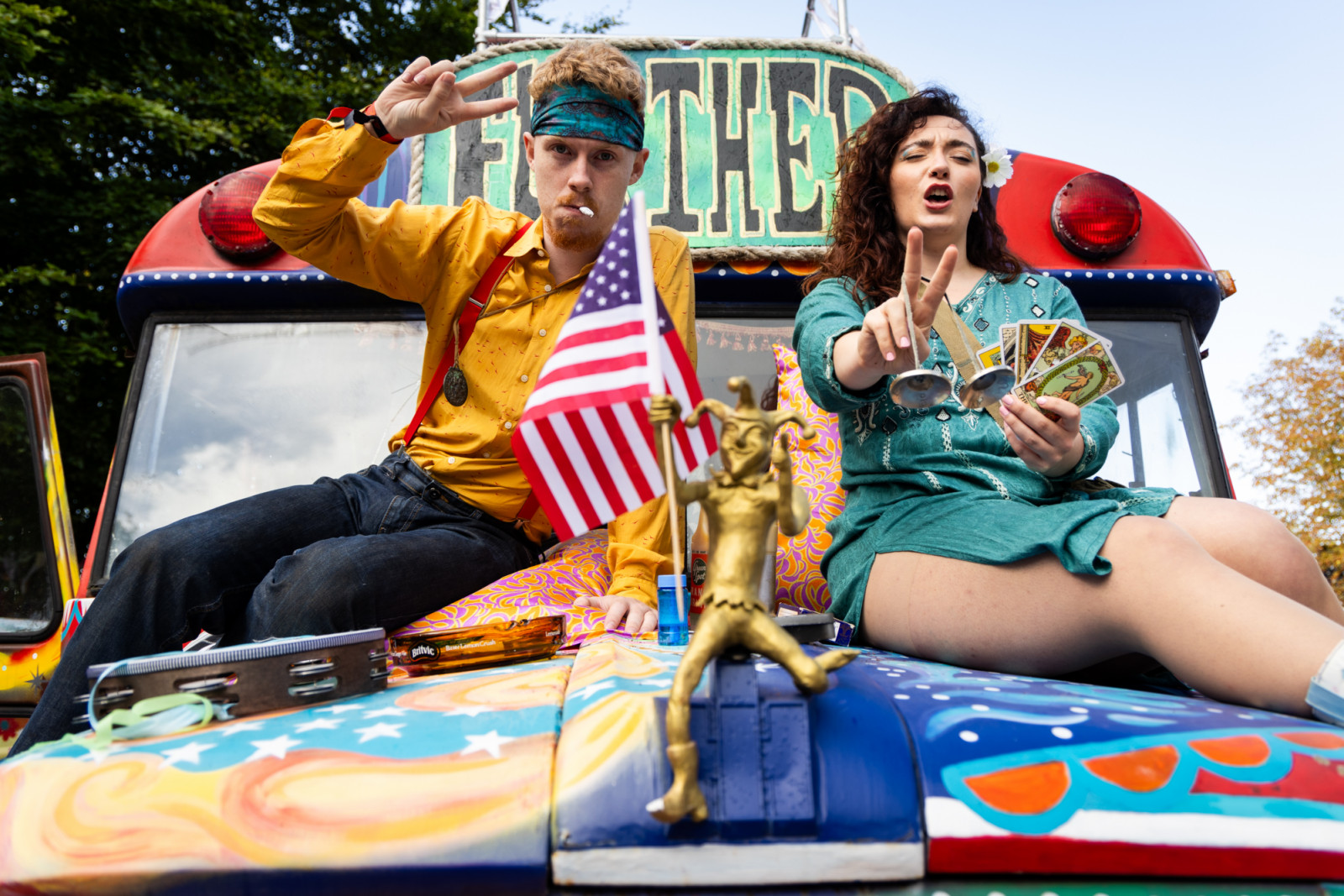 CHICHESTER, ENGLAND - SEPTEMBER 12: Re-enactors dressed as hippies during Goodwood Revival 2025 at Goodwood Motor Circuit on September 12, 2025 in Chichester, England. (Photo by Tristan Fewings/Getty Images)