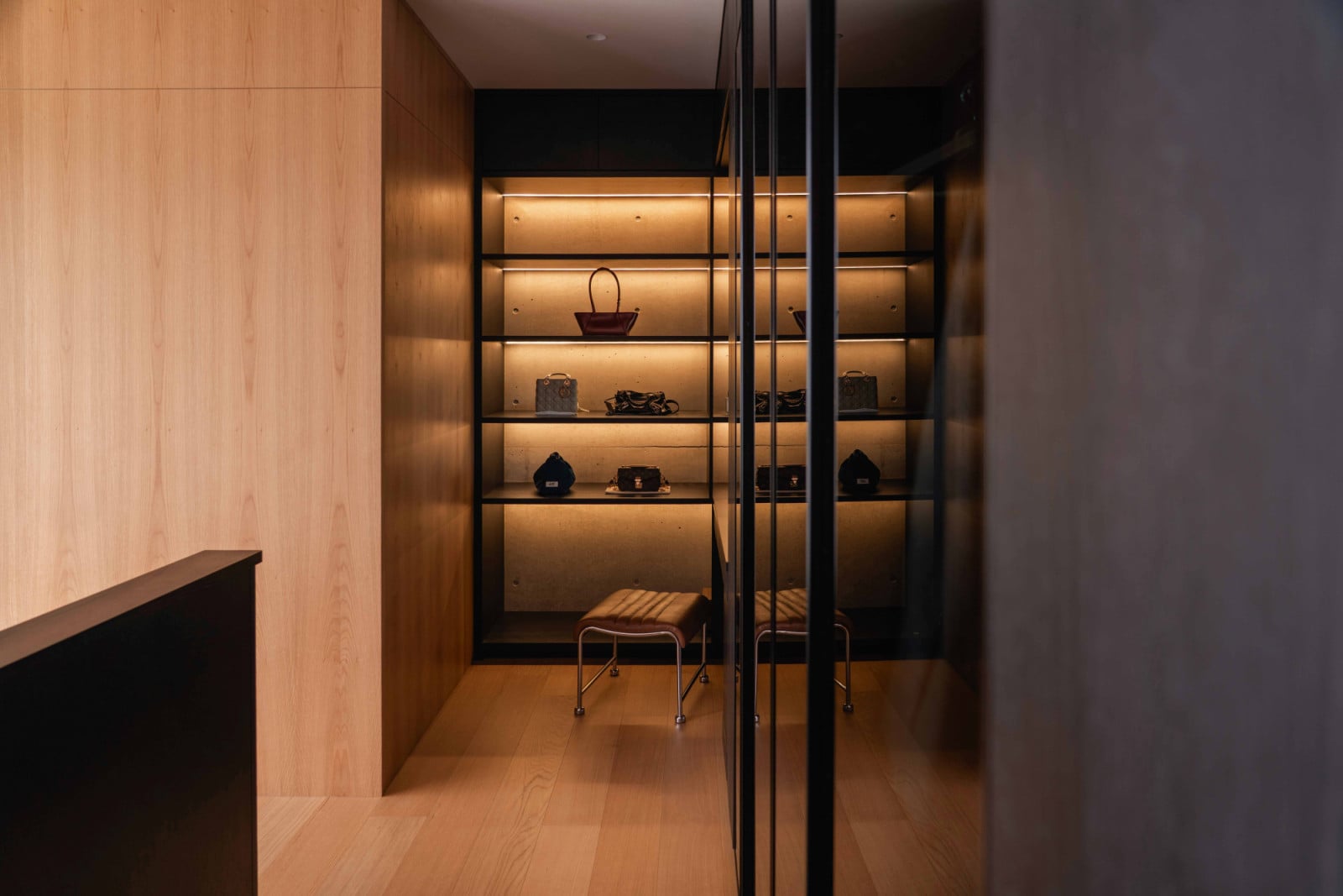 A walk-in wardrobe off the master suite doubles as a backlit display space