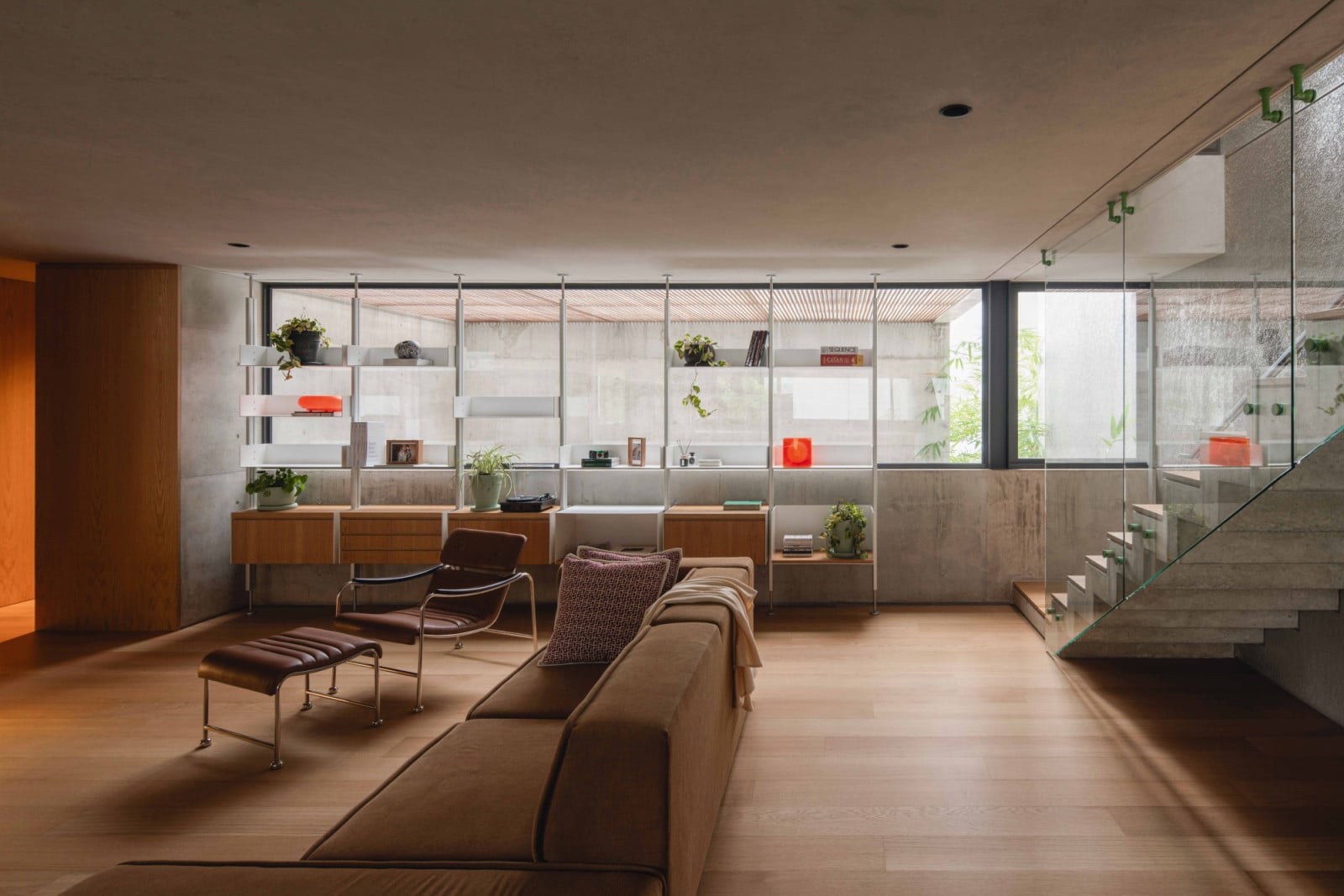 The mezzanine’s library and lounge area looks out through glazing towards the stairway